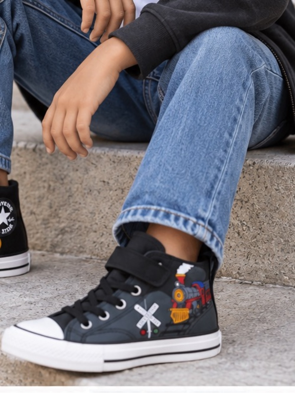 Converse Kids Black High-Top Sneakers with Multi-Color Train Graphic.